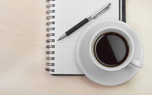 Notepad and coffee - a writing habit